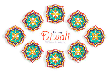 Happy Diwali - Clay Diya lamps lit during Dipavali, Hindu festival of lights celebration. Colorful traditional oil lamp diya on white background. Copy space for text.