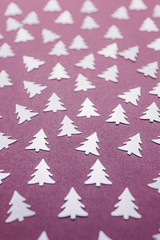 Festive silver Christmas tree-shaped confetti. Mother of pearl lilac background. New Year and...