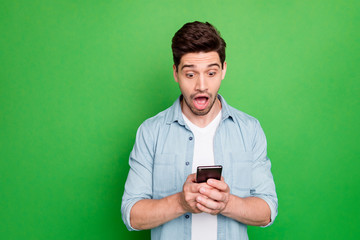 Photo of amazing guy holding telephone read instagram post negative comments not believe eyes open...