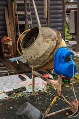 Mobile concrete mixer at a construction site, vertical image