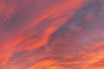 Naklejka na ściany i meble Dramatic fiery sky sunset cloudscape at dusk