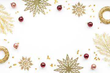 Gold and red christmas decoration on white background, flat lay, top view