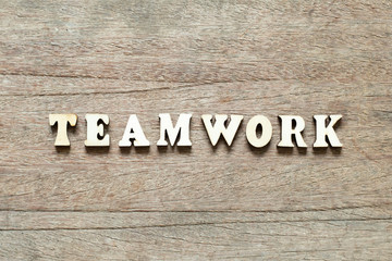 Letter block in word teamwork on wood background