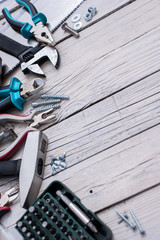 Hand tools on wooden background