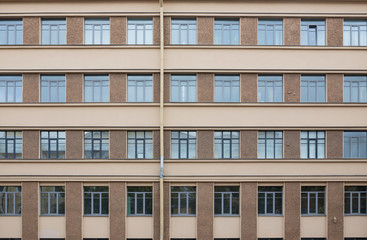 Vintage architecture two colors facade with square windows front view
