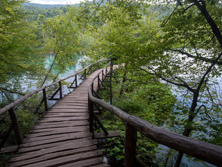 Fototapeta premium Croatia, august 2019: Picturesque view of Plitvice National Park. Colorful summer scene of green forest with pure water waterfall. Great countryside landscape of Croatia.