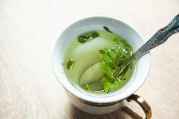 green tea on grass on desk