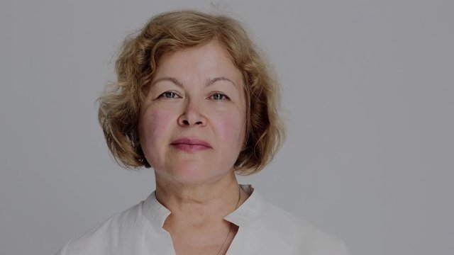 Portrait of the Senior Caucasian Woman Looking Straight to the Camera and Smiling. Confident and Respectable Woman Close-up.