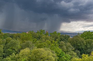 A heavy rain over Granada. Mountains and city covered by a thundercloud