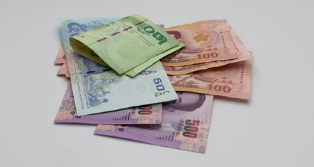 Close up Many Thai banknotes placed on a white background Conceptual interpretation of means to expand Whether saving money or investing For the growth to grow even more For stability in the future