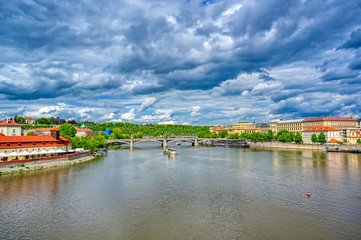 Fototapeta premium A view of Old Town Prague and the Charles Bridge across the Vltava River in Prague, Czech Republic.