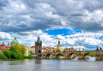 A view of Old Town Prague and the Charles Bridge across the Vltava River in Prague, Czech Republic.