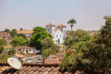 Pirenopolis, Goias, Brazil, October 18, 2019: The landscape at the end of the day and the towers of Nossa Senhora do Ros&aacute;rio Church in the historic center of Pirenopolis