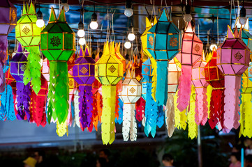 Fototapeta na wymiar row of colorful paper lanterns decoration in wat during Loy Kratong festival / Yee Peng