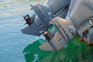 boat propellers on hub of outboard motor