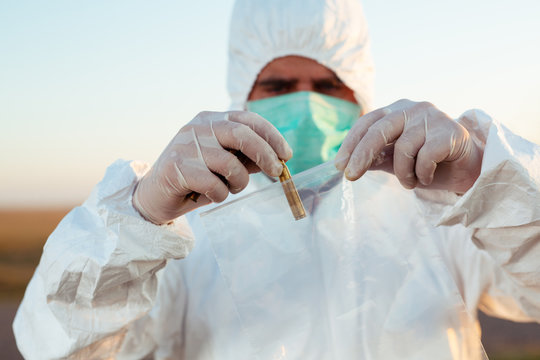 Crime scene investigation - collecting bullet of gun on the ground.