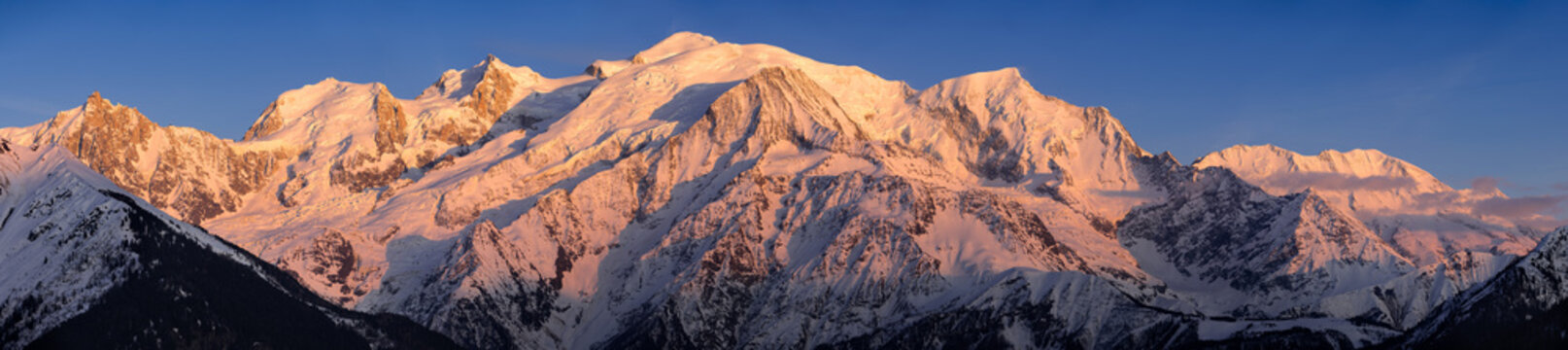 Mont Blanc mountain range at sunset. Aiguille du Midi needle, Mont Blanc du Tacul, Bossons Glacier, Mont Blanc. Chamonix, Haute-Savoie, Alps, France