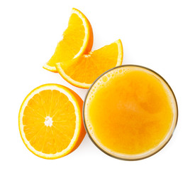 Glass of orange juice with half and pieces on a white background. The view of the top.