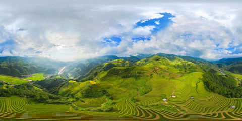 360 panorama by 180 degrees angle seamless panorama view of paddy rice terraces, green agricultural fields in rural area of Mu Cang Chai, mountain hills valley in Vietnam. Nature landscape background. © tampatra