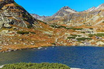 Beautiful mountain lake over Skok wterfall - the autumn Pleso nad Skokom among peaks of High Tatra mountains © andras_csontos