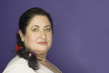 Woman with pigtail decorated with a red bow