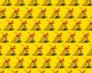 Christmas toys gold bells pattern on yellow background