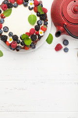 Fototapeta na wymiar Cheesecake with berries and chocolate
