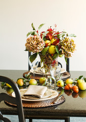 Autumn table decoration. Thanksgiving table setting with autumn decorations