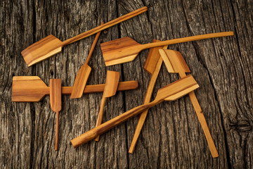 Wooden kitchen utensils on rustic background close-up. Flat lay.
