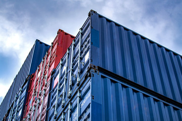 Stack of containers box from Cargo freight ship for import-export at harbor and transportation...