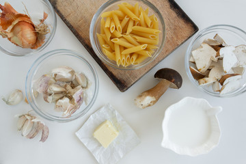 Top view of ingredients for cream pasta with porcini mushrooms (Boletus edible)
