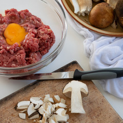 Top view of ingredients for meatballs with porcini mushrooms (edible Boletus)