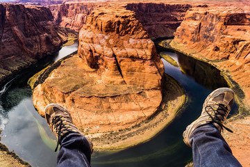 Feet hanging above landscape