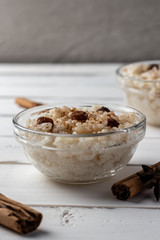 Delicious peruvian dessert arroz con leche, rice with milk, cinnamon and rises