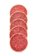 Salami sliced. Raw smoked sausage slices with herbs and spices, isolated on white background