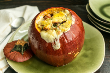 Pumpkin stuffed with a mixture of bread, cheese, bacon, and herbs and baked until the filling has melted