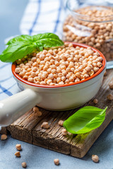 Raw chickpeas and green basil.