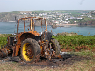 Burnt out tractor South Devon Coast