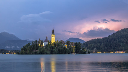 Lake bled with church under lightning storm