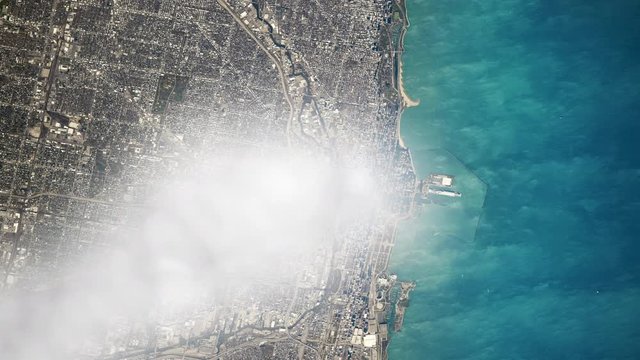 Cloud moving on city downtown Chicago Illinois, lake Michigan and city harbour aerial satellite view animation. Contains public domain image by Nasa