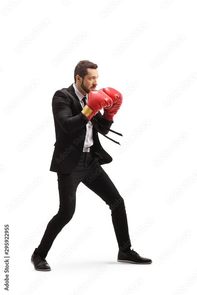 Poster man in a suit with boxing gloves in a guard position