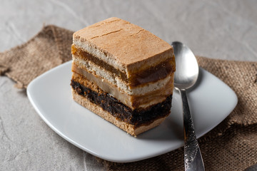 Delicious peruvian dessert called King Kong with dulce de leche and jam.