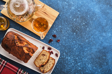 Banana bread. Freshly baked homemade banana pie on a blue table. Top view