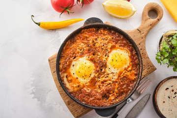 Shakshuka, Fried Eggs in Tomato Sauce. Traditional Mediterranean Fried Eggs. Israeli cuisine.