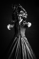 Spooky images of woman in black vintage outfit