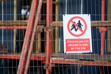 Children playing on scaffold not allowed safety sign at construction building site