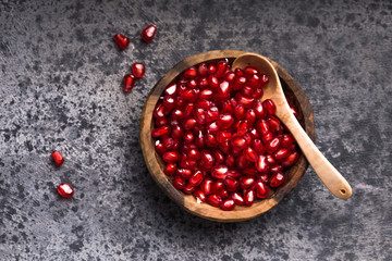 Fresh sliced pomergranate on a plate on a table