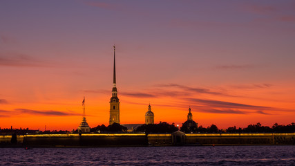 Fototapeta na wymiar Peter and Paul Fortress against the backdrop of a crimson sky