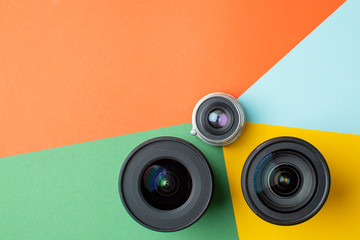 three photo lenses, on a colored background, a set of photo devices for the camera