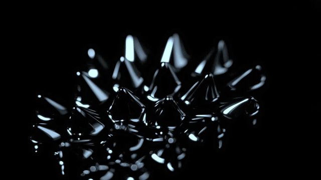 Super Slow Motion Macro Shot of Magnetic Liquid Ferrofluid in Motion at 1000fps. Shooted with High Speed Cinema Camera at 4K.